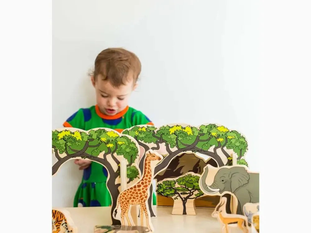 Wooden toy safari set featuring trees and various African animals.