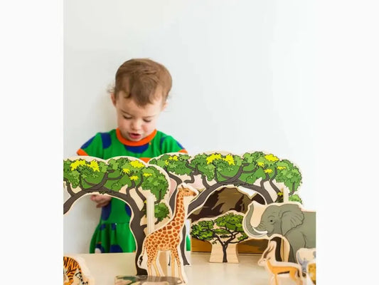 Wooden toy safari set featuring trees and various African animals.