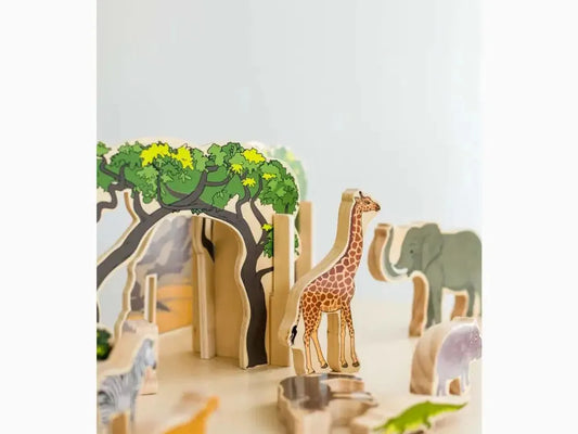 Wooden toy safari set featuring various animal figures and trees.