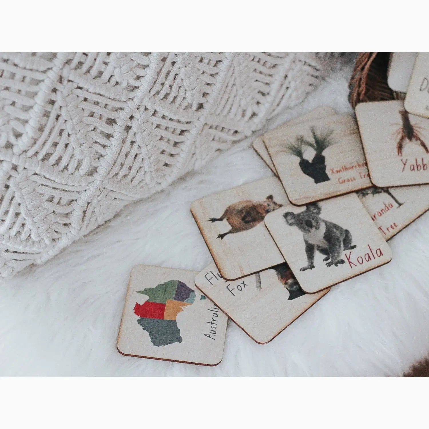 Set of wooden animal flashcards or memory game pieces.