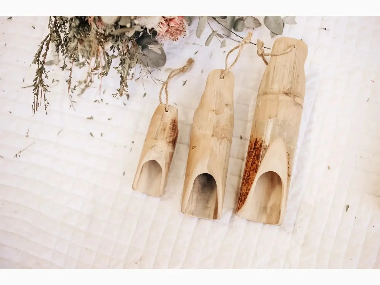 Three bamboo scoops.