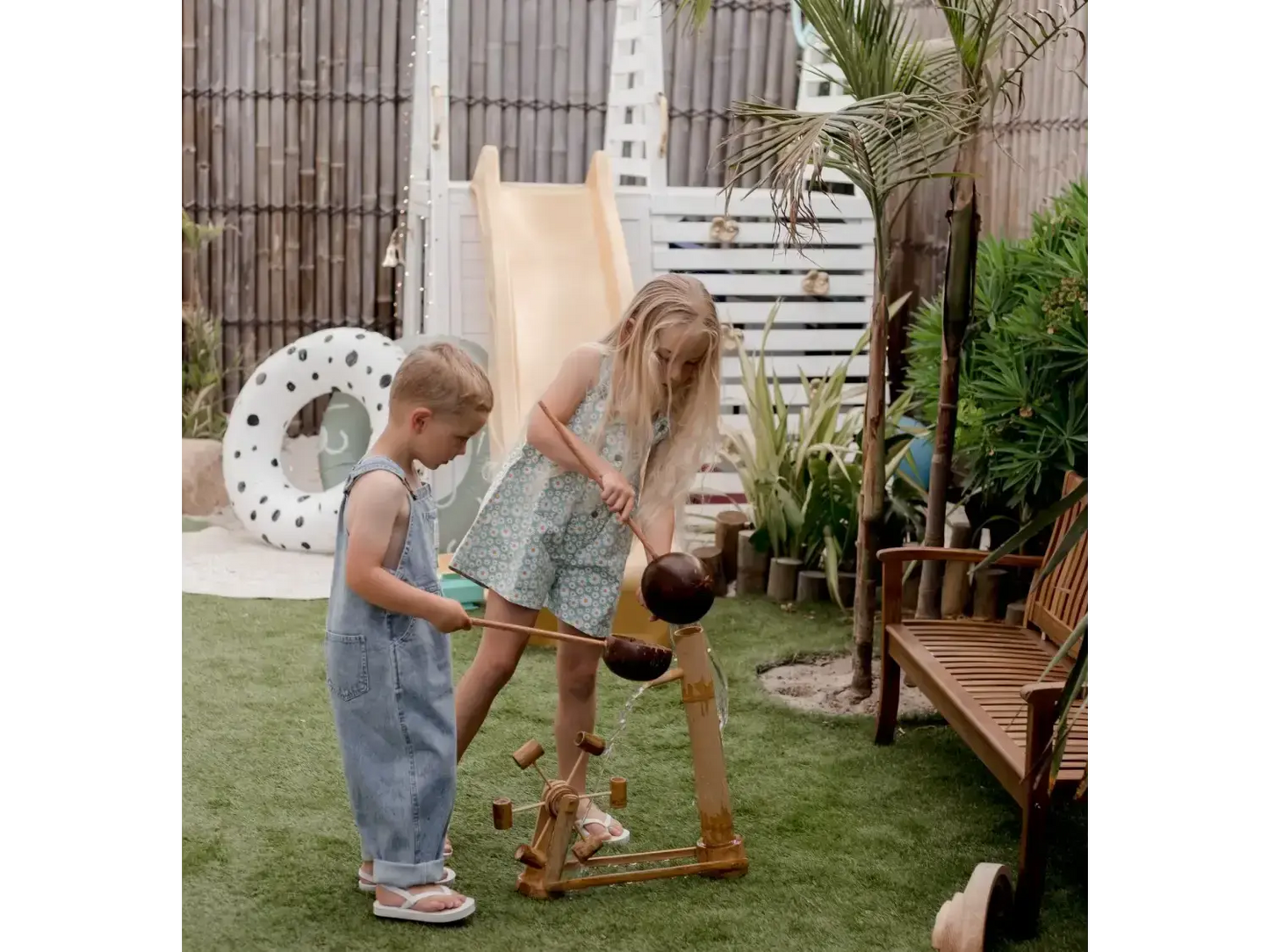 Children playing with a wooden toy.