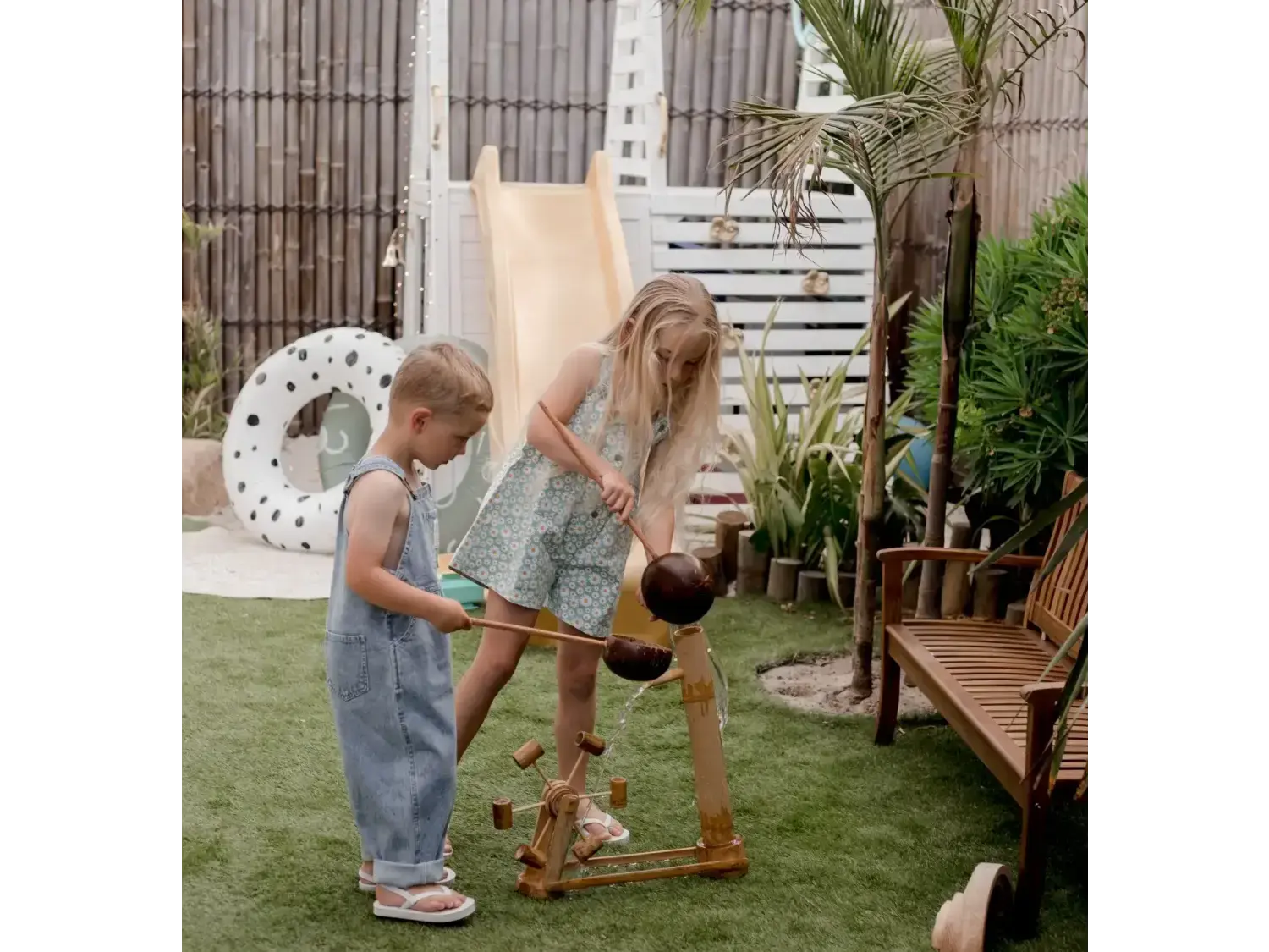 Children playing with a wooden toy.
