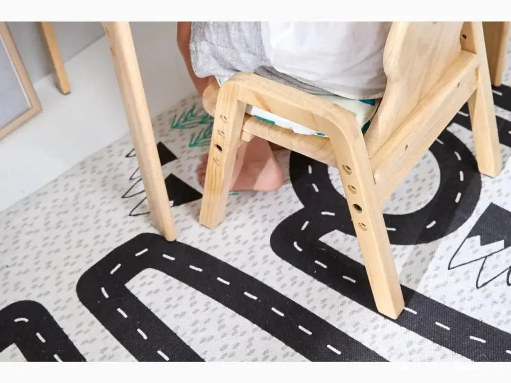 Wooden chair or stool with visible legs on a patterned rug.