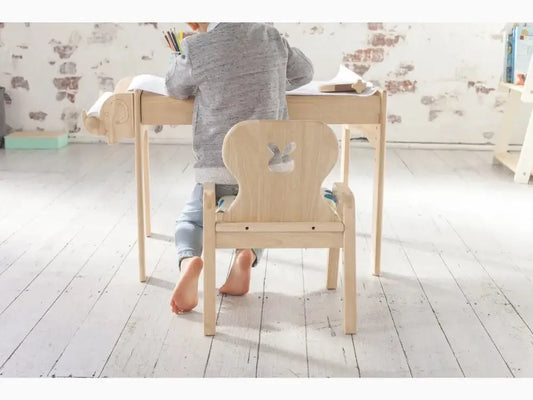 Child-sized wooden desk and chair set.