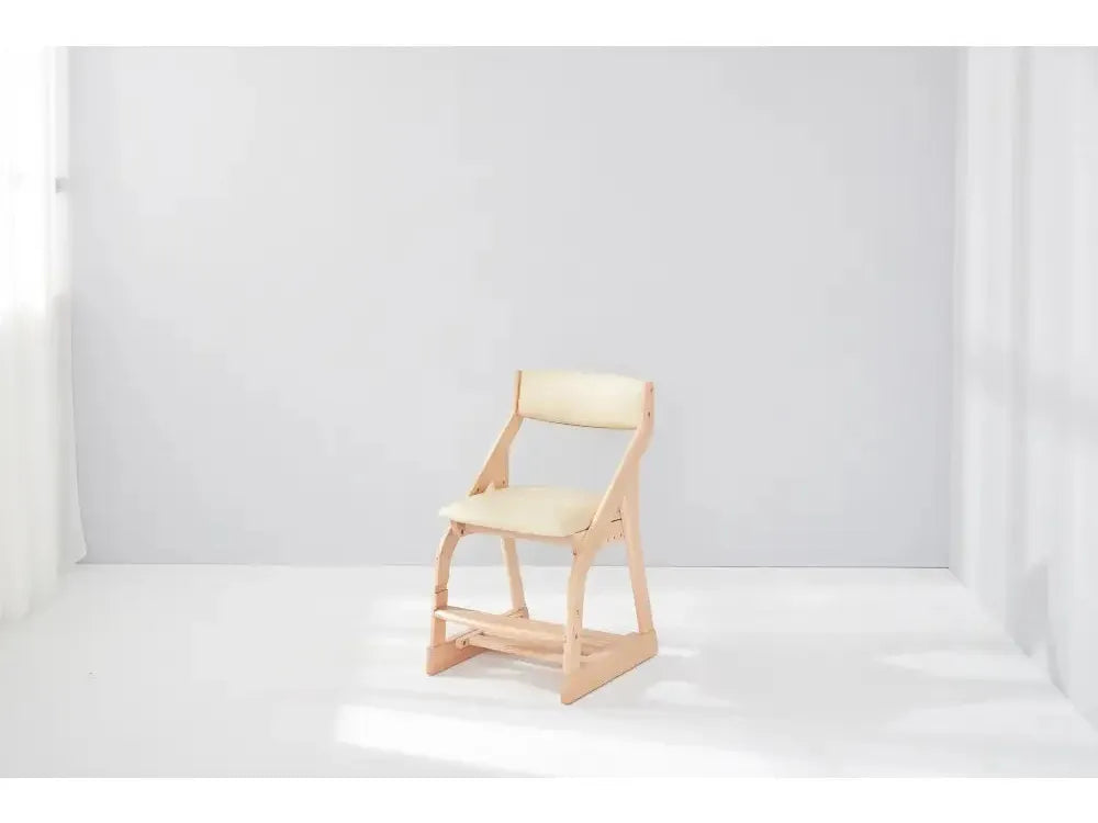 Wooden chair with a light-colored seat and backrest.