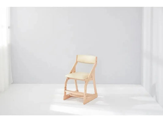 Wooden chair with a light-colored seat and backrest.