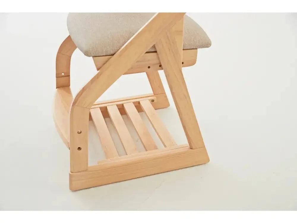 Wooden chair leg with curved design and vertical slats.