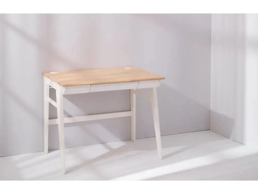 Simple wooden desk with white legs and a natural wood top.