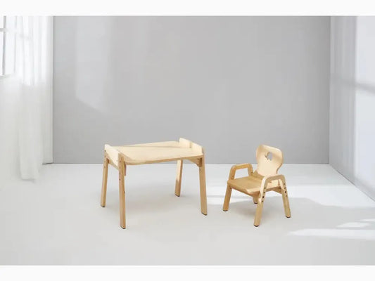 Wooden children’s desk and chair set with minimalist design.