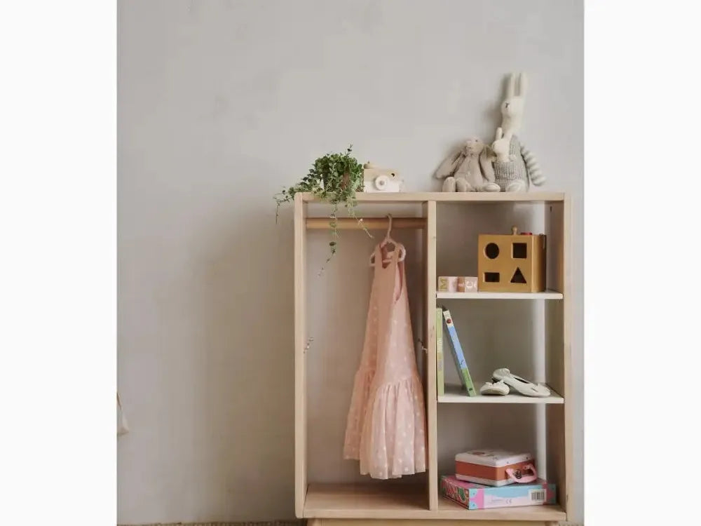 Wooden shelving unit with hanging space and compartments for storage.