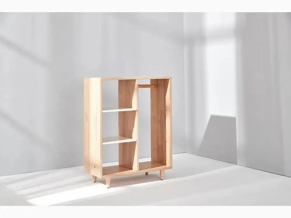 Modern wooden bookshelf with asymmetrical compartments.