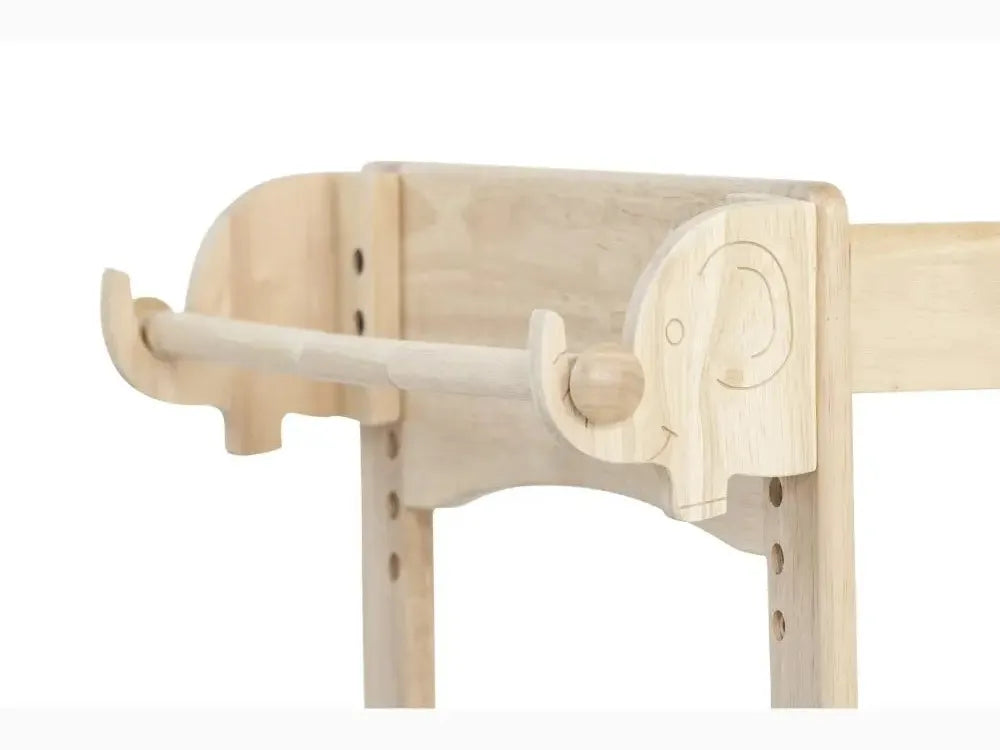Wooden elephant-shaped towel or coat rack with curved trunk.