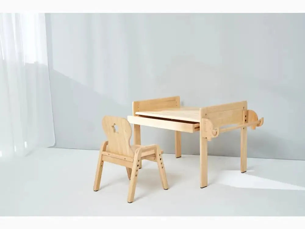 Wooden children’s desk and chair set with a minimalist design.