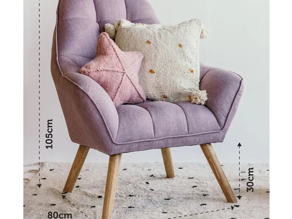 Lavender upholstered armchair with wooden legs and decorative cushions.
