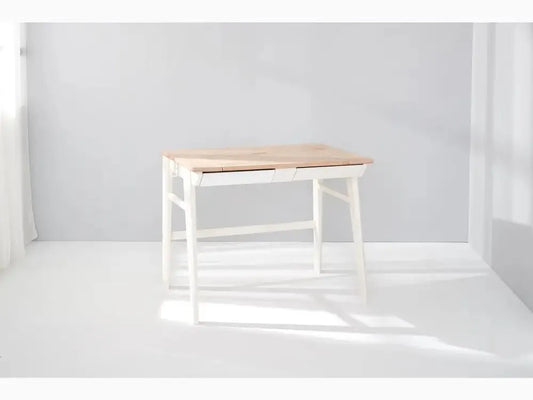 Simple wooden desk with white legs and a natural wood top.