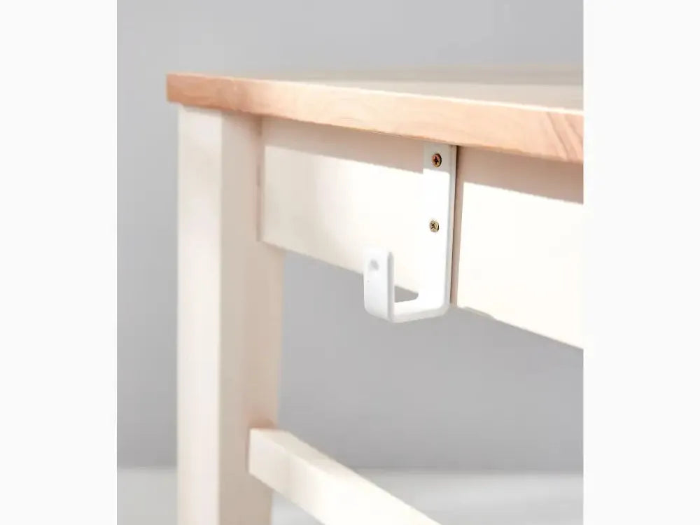 Hook or hanger attachment for a table or desk edge.