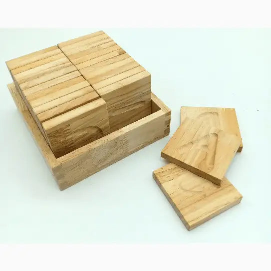 Wooden blocks or tiles arranged in a box with some pieces outside.