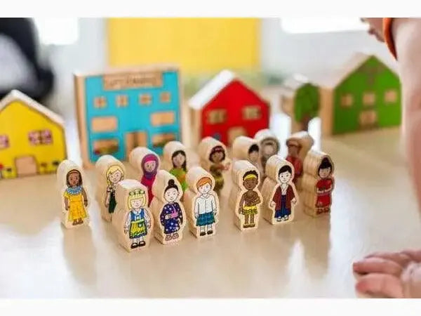 Wooden toy figures representing diverse children standing in a row.