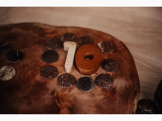 Chocolate cake decorated with cookies and a number 10 candle.