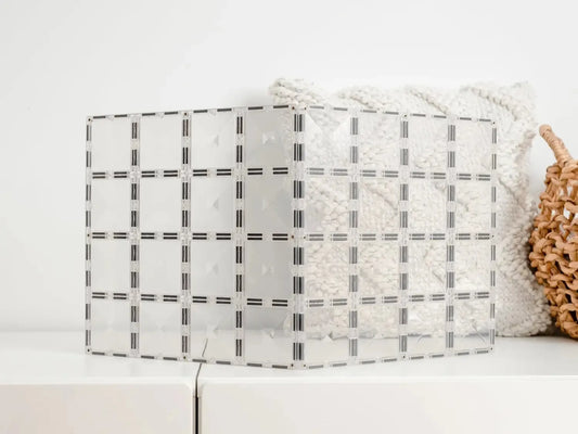 Translucent lampshade with a grid pattern.