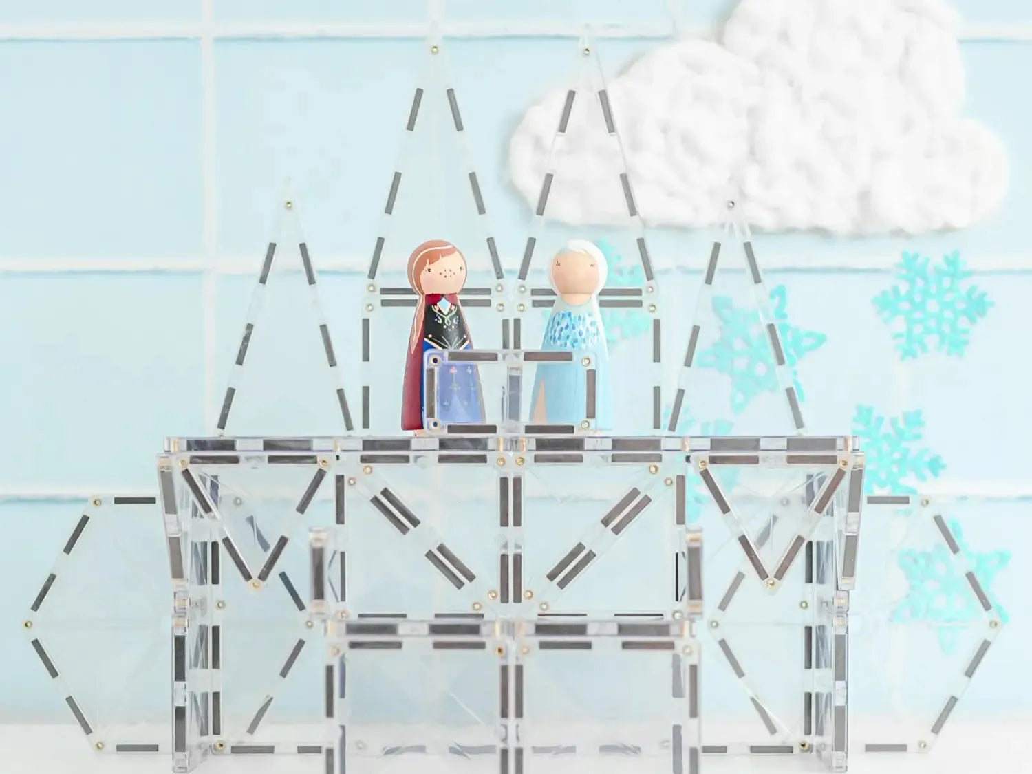 Geometric outline of a ship with two small figures on top.