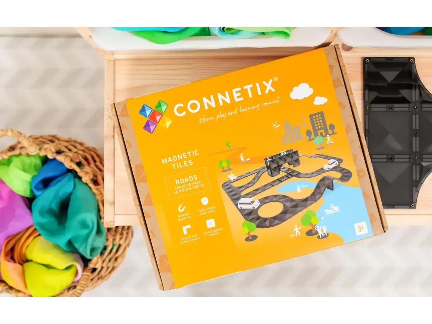 Connetix magnetic tile toy set box with colorful graphics depicting construction scenes.
