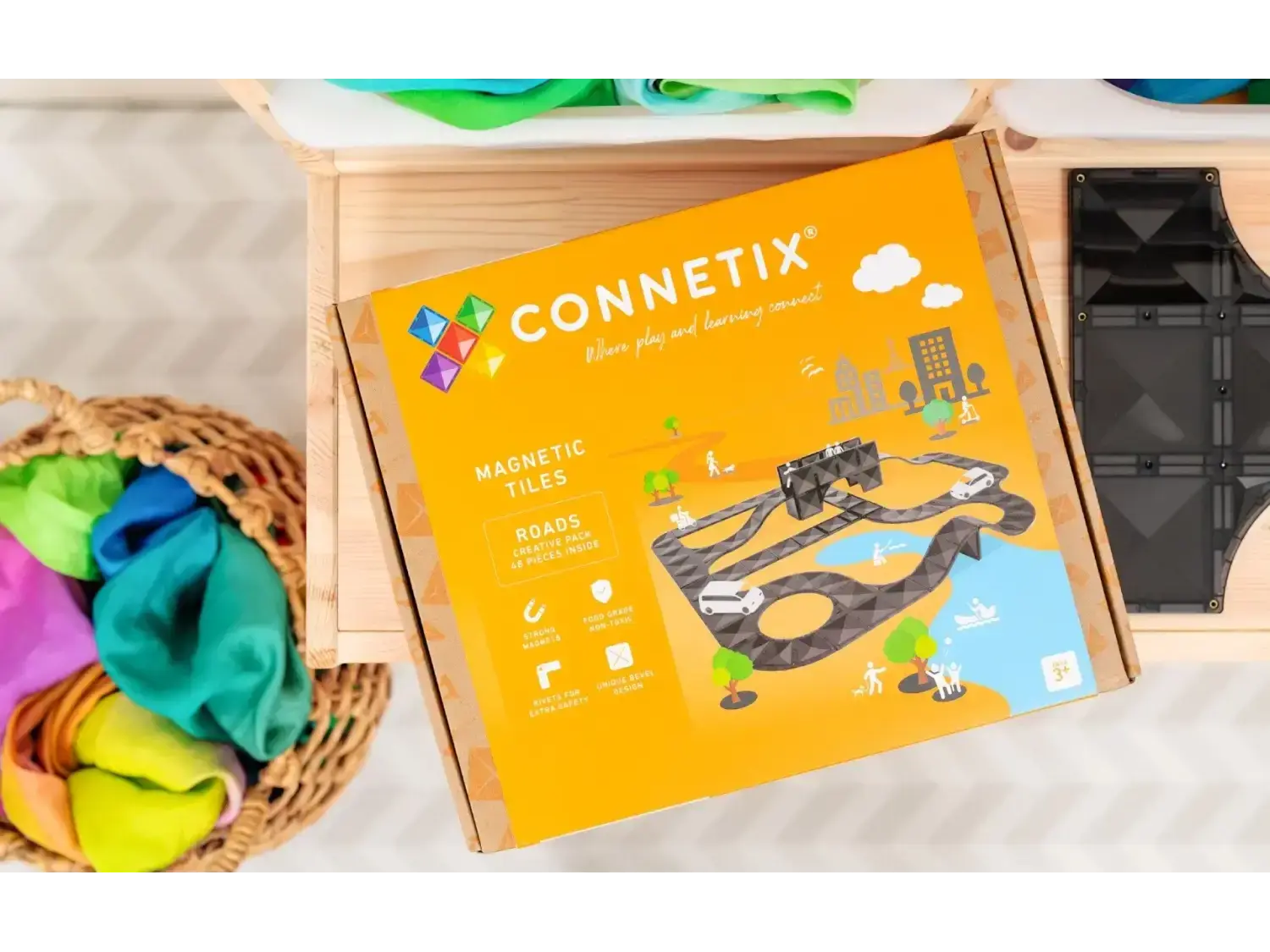 Connetix magnetic tile toy set box with colorful graphics depicting construction scenes.