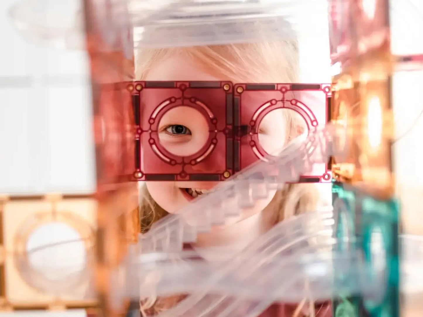 Unusual red eyeglasses or goggles with circular lenses.