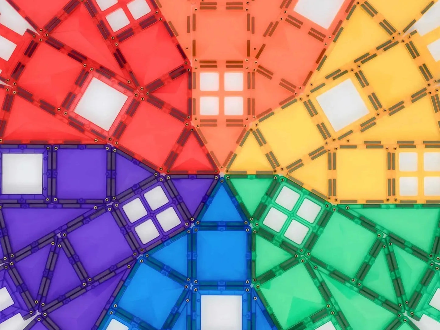 Colorful geometric magnetic tiles arranged in a circular rainbow pattern.