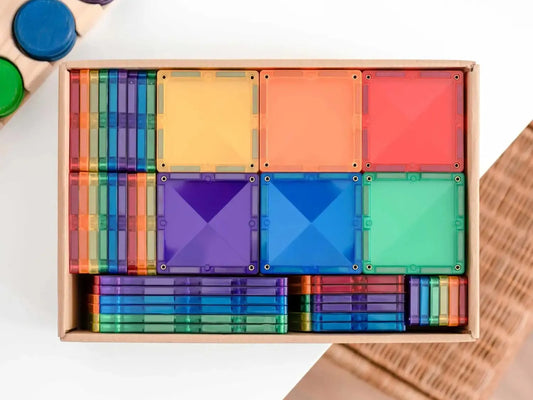 Colorful wooden geometric shape sorting toy set in a rectangular box.