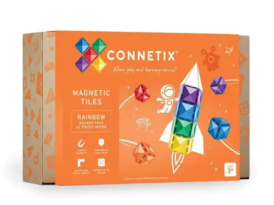 Box of Connetix magnetic tiles featuring colorful geometric shapes and a rocket design.