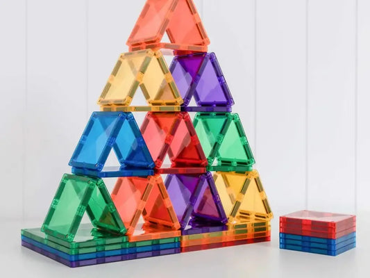 Colorful triangular magnetic building tiles stacked into a pyramid shape.