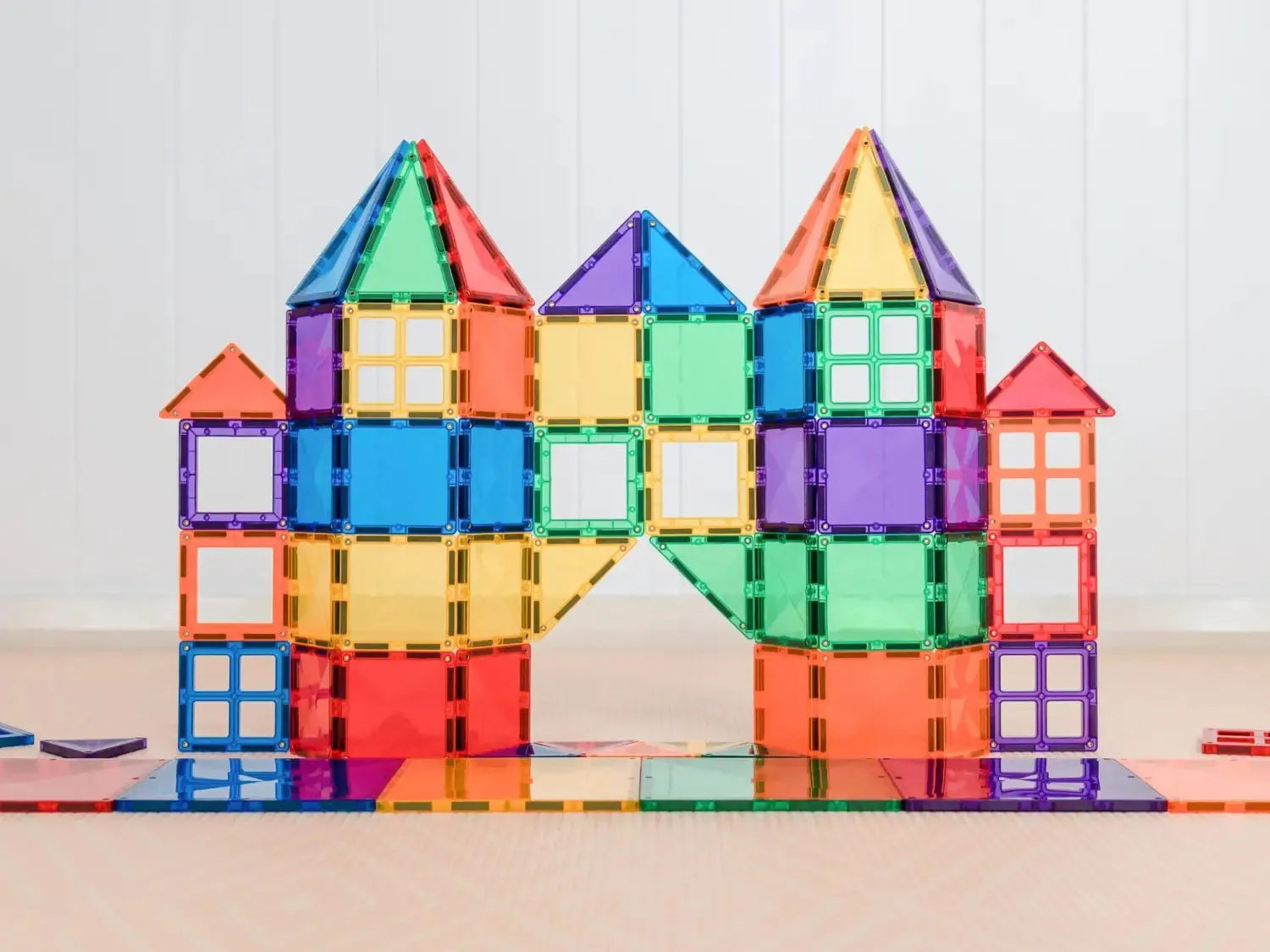 Colorful magnetic tile construction forming a castle-like structure.