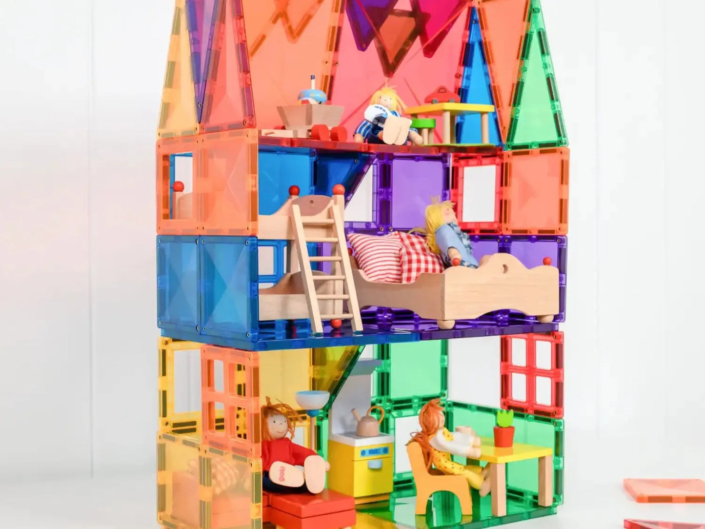 Colorful multi-level dollhouse with various rooms and furniture.