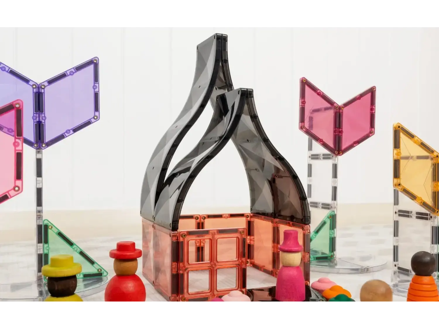 Sleek, curved metallic sculpture resembling two intertwined forms or a stylized bottle shape.