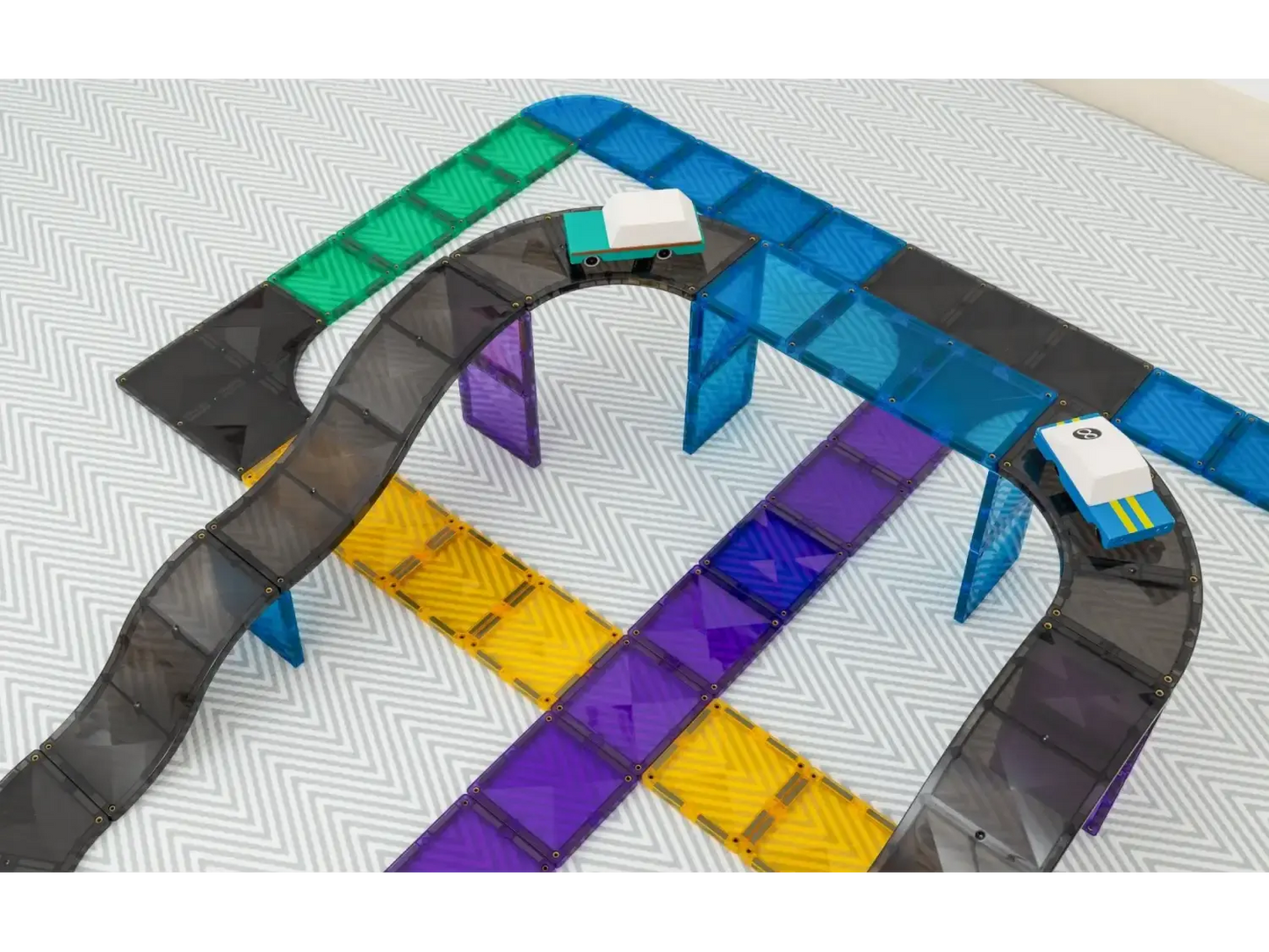Colorful, interconnected track segments resembling a toy race track or building set.