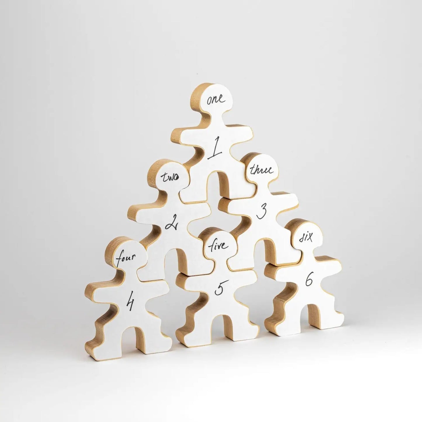 Pyramid-shaped stack of numbered wooden human figure cutouts.
