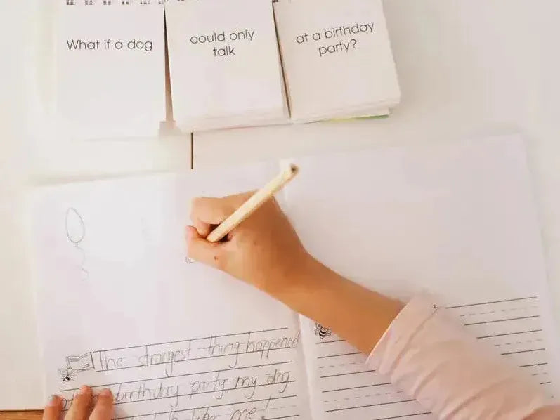 Hand holding a pencil writing on a sheet of paper with musical notation.
