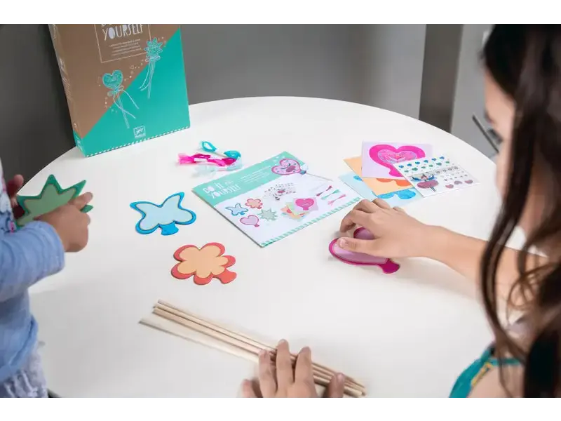Craft kit with shapes and sticks.