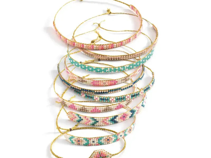 Stack of colorful beaded bracelets.