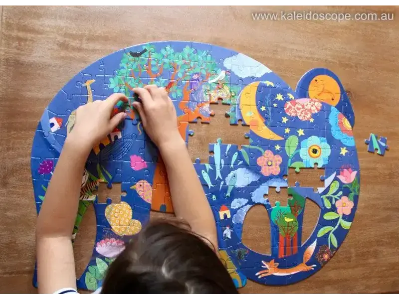 Colorful jigsaw puzzle with whimsical space-themed illustrations being assembled.