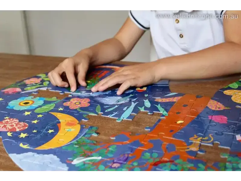 Colorful puzzle with space-themed illustrations being assembled by small hands.