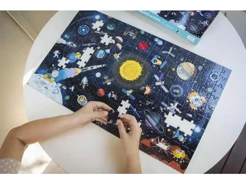 Space-themed jigsaw puzzle being assembled on a white surface.