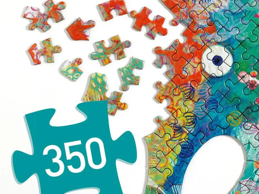 Colorful, partially assembled jigsaw puzzle depicting a stylized elephant.