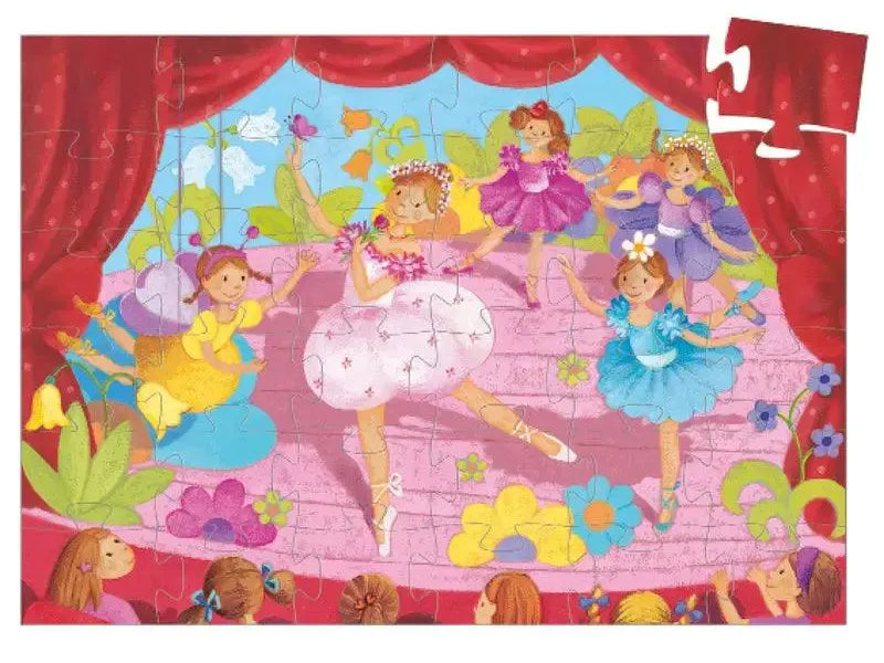 Colorful jigsaw puzzle depicting young ballerinas performing on stage.