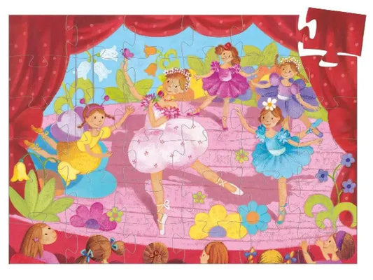 Colorful jigsaw puzzle depicting young ballerinas performing on stage.