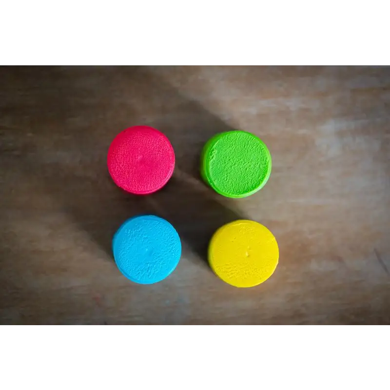 Four colorful circular objects arranged in a square pattern.