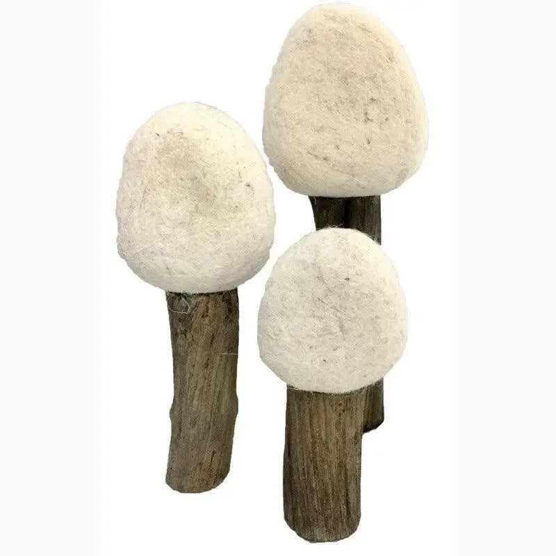 Wooden sticks topped with round, white, fluffy shapes resembling mushrooms or cotton balls.