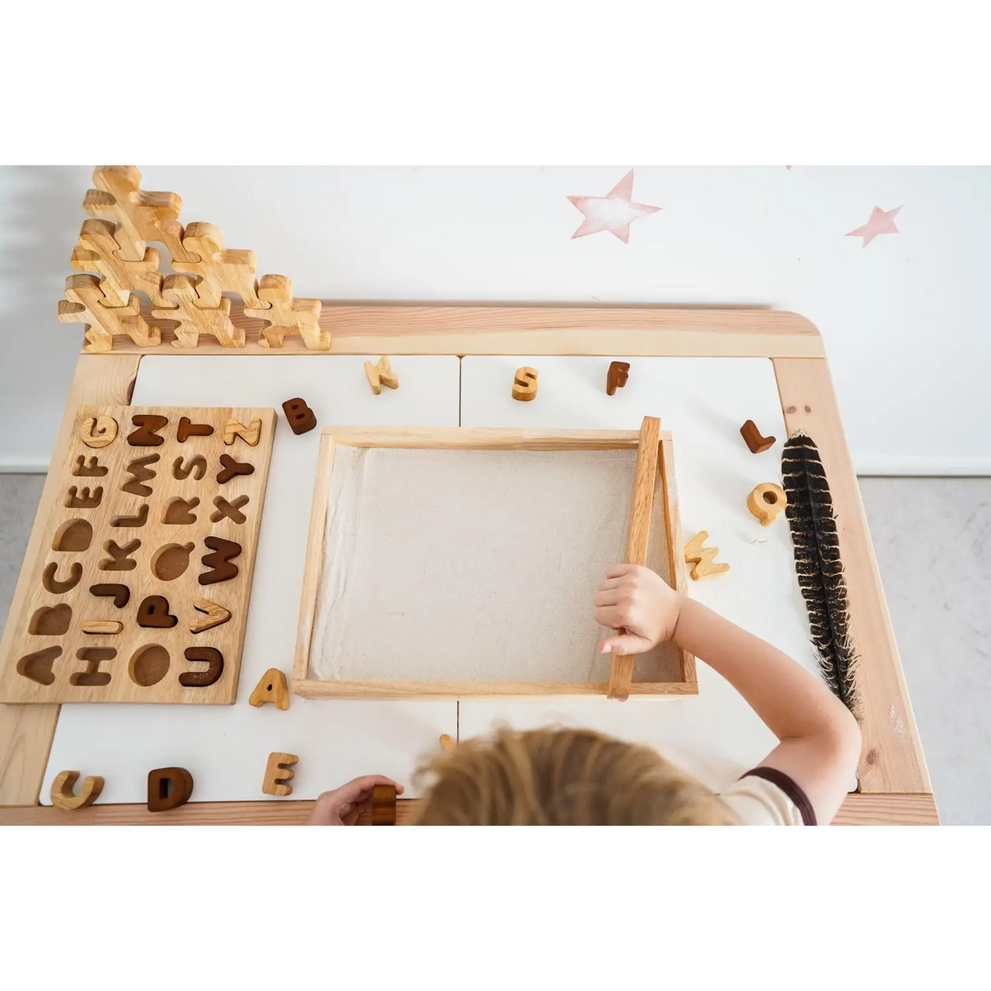Wooden educational toy with alphabet letters and a drawing board.